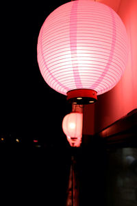 Low angle view of illuminated lights at night