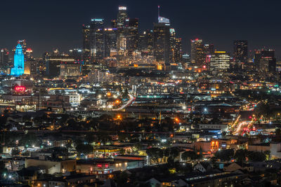 Illuminated city lit up at night