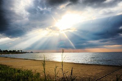 Scenic view of sea against cloudy sky