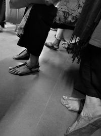 Low section of people standing on floor