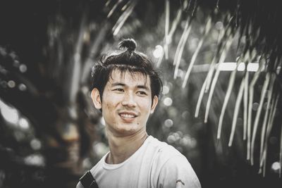 Portrait of young man standing outdoors