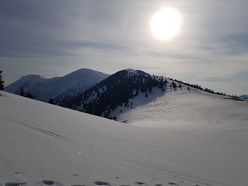 Scenic view of snowcapped mountains against sky