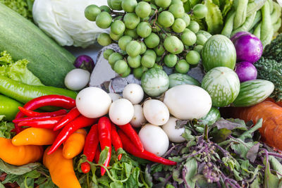 High angle view of multi colored chili peppers