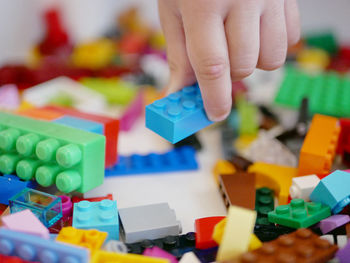 Close-up of hand playing with toy