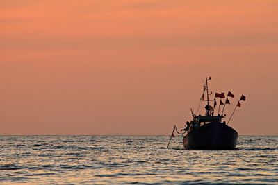 Scenic view of boat at dusk