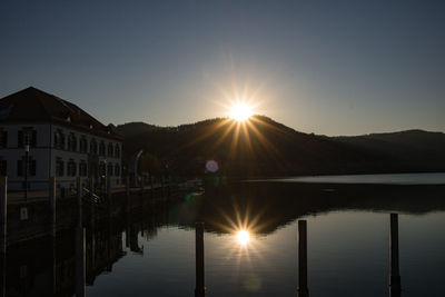 Scenic view of lake against sky during sunset