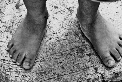 Low section of people standing on tiled floor