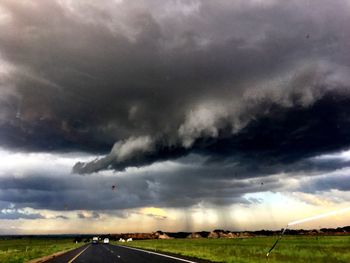 Storm clouds over field