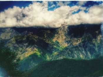 Scenic view of landscape against cloudy sky