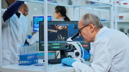 Side view of businessman working in laboratory