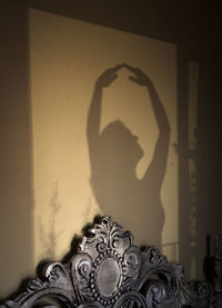 Shadow of woman on wall