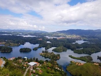 Scenic view of lake and mountains against sky