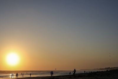 Scenic view of sea against clear sky during sunset