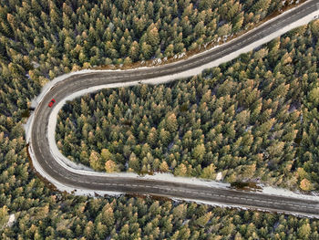 Drone aerial view of mointain toad curve among woods