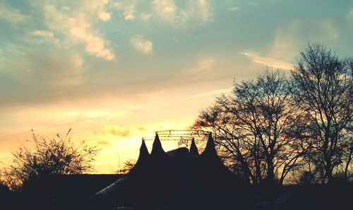 Silhouette of trees against sky at sunset