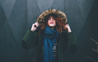 Portrait of young woman standing in winter