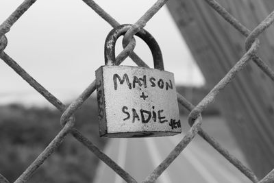 Close-up of padlocks on fence