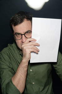 Portrait of man wearing eyeglasses