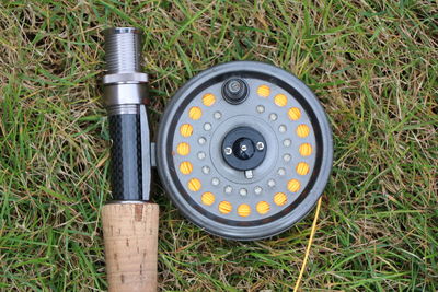 High angle view of rusty wheel on field