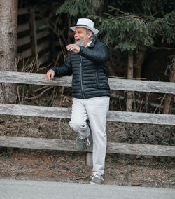 Portrait of a confident, handsome, mature man during his walk in the park