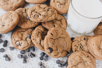 Close-up of cookies by milk glass