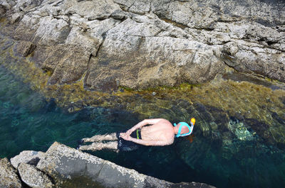 High angle view of person swimming in sea