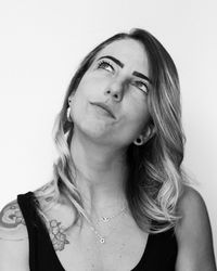 Portrait of young woman against white background