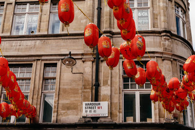 Low angle view of lanterns hanging on building