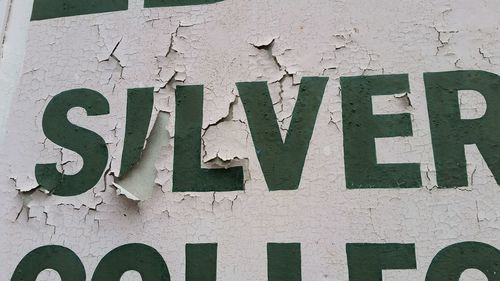 Full frame shot of text on brick wall