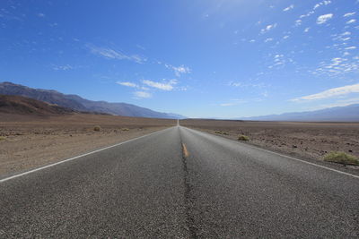 Empty road along landscape