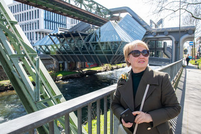 Middle-aged woman making a report of the wuppertal suspension railway train