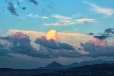 Scenic view of mountains against sky during sunset