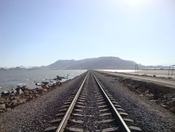 Railroad tracks against clear sky