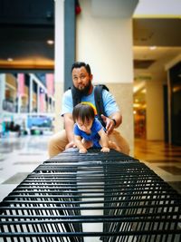 Father and daughter on railing