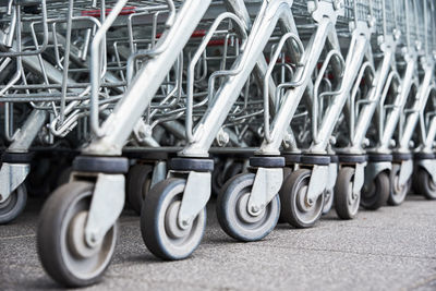 Many empty shopping carts on the shop parking