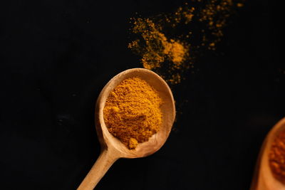 Close-up of orange juice against black background