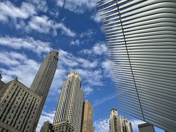 Low angle view of modern buildings against sky