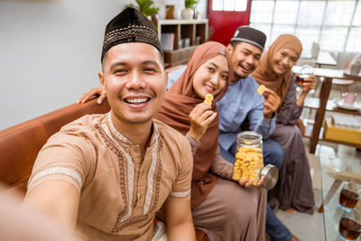 Couple taking selfie at home