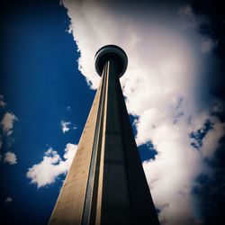 Low angle view of building against cloudy sky