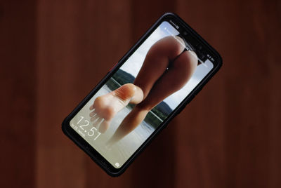 Close-up of hand holding mobile phone