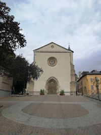 Facade of historic building against sky