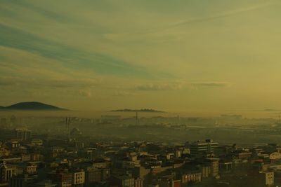 Cityscape against sky during sunset