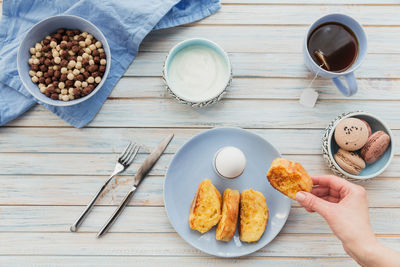 French fried toast with tea, boiled eggs and fresh yogurt. tasty farmer breakfast. flat lay