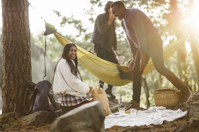 Young couple in basket on tree