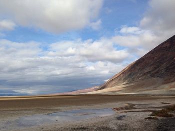 Scenic view of sea against cloudy sky