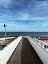 Pier over sea against sky