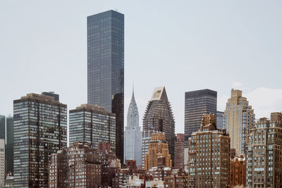 Low angle view of buildings in city against sky