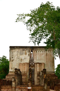 Low angle view of old building against sky