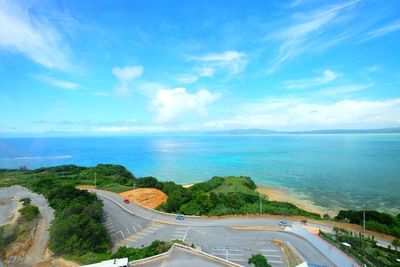 Panoramic view of road by sea against sky