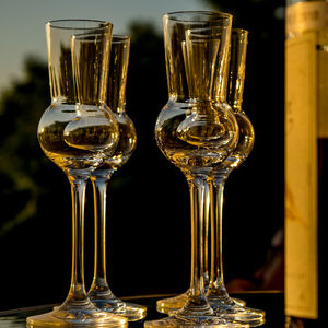 Close-up of wine glasses on table